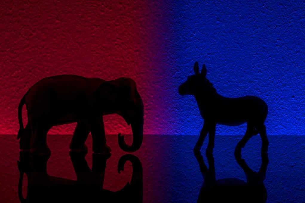 Elephant and donkey silhouettes on red and blue backgrounds.