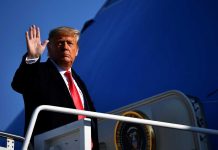 Trump Pardon Backfires — ASSASSINATION Plot Exposed! A political figure waving while standing on the steps of an aircraft