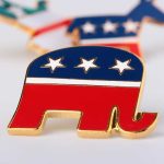 Governors Campaign Bus EXPLODES – Up in Flames! A red, white, and blue elephant pin representing the Republican Party