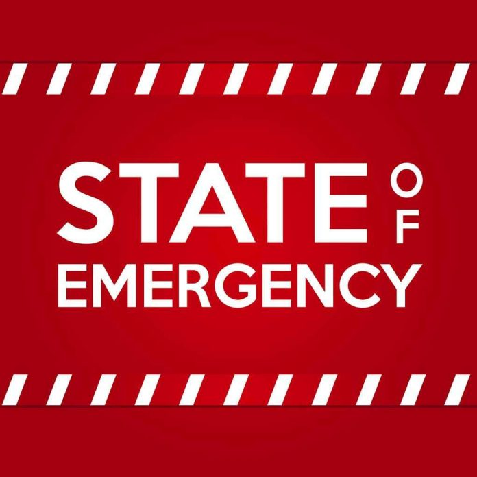 STATE OF EMERGENCY in bold white text on red background.