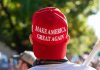 Swing State Uprising – Trump’s Core Turns Furious Person wearing a red Make America Great Again hat.