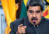Venezuela MOBILIZES 200,000 Troops – Targets America Man speaking passionately and gesturing during a speech.