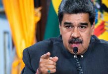 Venezuela MOBILIZES 200,000 Troops – Targets America Man speaking passionately and gesturing during a speech.