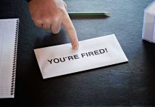 Verizon BLOODBATH—15,000 Jobs Axed Overnight Envelope with YOURE FIRED! and pointing finger.