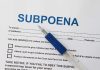 SHOCKING Subpoena Blitz: Trump’s Legal Gambit Unfolds A subpoena document with a blue pen resting on it
