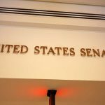 Senator COLLAPSES – Serious Health Scare! Sign displaying United States Senate in a government building