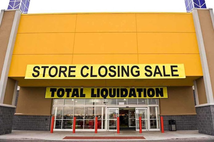 Exterior of a store with a large sign announcing a closing sale and total liquidation