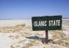 Governor Candidate Issues EXTRAORDINARY Pledge—Why This Changes Everything A weathered sign reading 'ISLAMIC STATE' in a barren landscape