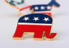 A red, white, and blue elephant pin representing the Republican Party