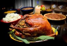 Stranger CRASHES Thanksgiving Dinner – What Happens Next! A beautifully roasted turkey on a festive table surrounded by side dishes and decorations