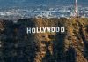 Clooney DITCHES Hollywood After Decades Destroying It The Hollywood sign on a hillside.