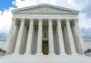 SCOTUS Picks Up Case – Trump’s Constitutional CRISIS Building with columns under a cloudy sky.