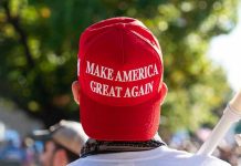 MAGA Crowd Crosses A Terrifying Line – Single Chant Person wearing a red Make America Great Again hat.