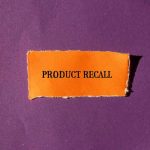 Nationwide Beef Recall ALERT: Severe Threat Looms Product Recall text on orange paper, purple background.