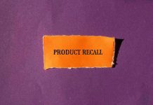 Product Recall text on orange paper, purple background.