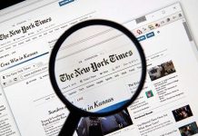 New York Times DECLARES WAR – Sues Pentagon! Magnifying glass over The New York Times website.
