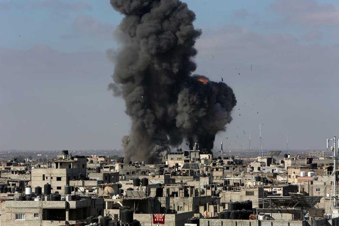 Large explosion over a crowded urban area.