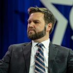 JD Vance Goes MISSING Before Dictator Raid Man in a suit with a thoughtful expression.