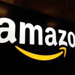 Amazon AXE 16,000 Jobs – Corporate Bloodbath! Amazon logo with a yellow smile arrow.