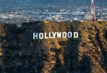 Hollywood Actor Found DEAD Behind Bars The Hollywood sign on a hillside.