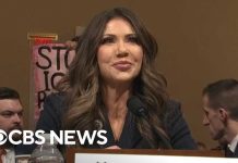 Activist STORMS Senate Hearing, Wearing HUGE Backpack