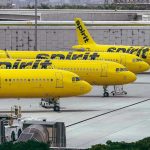 Fuel Crisis DESTROYS Budget Airline – What Next? Yellow airplanes parked on the airport tarmac.