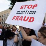 Democrat Admits Forging 1,000 Voter Documents! People holding Stop Election Fraud protest signs.
