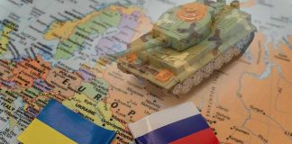 Trump UNLEASHES 3-Day Ceasefire — War Ending? Toy tank on map with Ukraine and Russia flags.