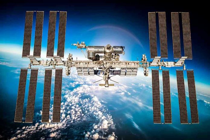 311480090 International Space Station orbiting above Earth.