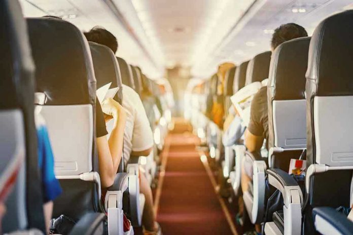 Passengers seated inside an airplane cabin.