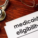 Medicaid SHOCK: The Truth Behind Ohio’s “Off Switch” Stethoscope pen document about Medicaid eligibility on table
