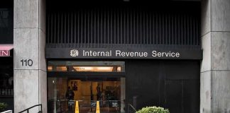 Justice Dept’s $10B Trump Deal Mystery Entrance of the Internal Revenue Service office with signage