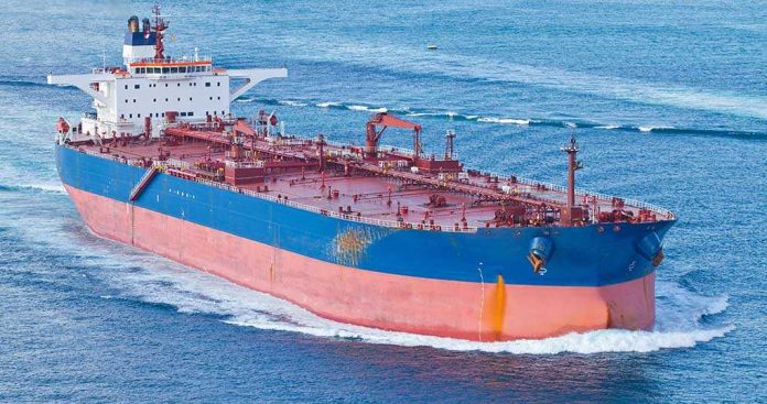 shutterstock_169715141 Large cargo ship navigating through the ocean