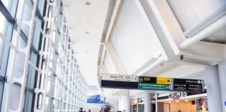 Airport Meltdown Looms at Newark Interior of an airport terminal with travelers and signage