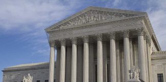 Biden’s Secret Audio: What’s He Hiding? The Supreme Court building featuring large columns and statues