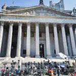 Court Showdown: Title IX Claim Backfires Courthouse facade with media crews setting up outside.