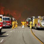 Utah Inferno Spirals Out of Control Firefighters battling large wildfire with fire trucks present