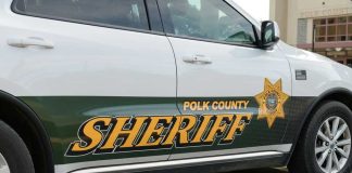 Sanctuary Showdown After Florida Dad Slain Polk County Sheriff vehicle parked outside building.