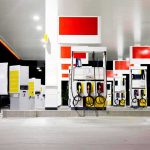 Summer Gas Squeeze — Who Let This Happen? Gas station fuel pumps at night