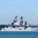 Long War Vibes — CENTCOM Widens The Map Aircraft carrier sailing on calm blue water