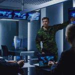 Victory Fantasy Meets Brutal Numbers military officer briefing team in command center