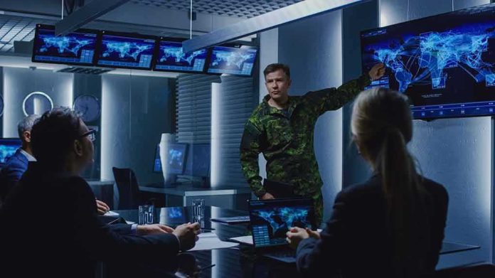 military officer briefing team in command center