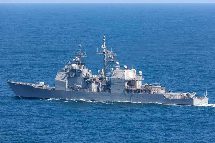 shutterstock_1408246997 Gray naval warship cruising on open sea