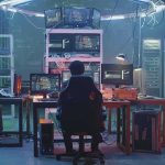 Lab-Leak Dissent—Silenced With Cash? People working at computers in a dim server room