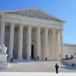 Extradition Brawl: Tates vs. Britain Supreme Court building with grand columns and steps