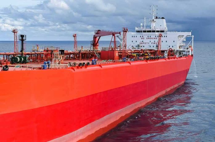 Red oil tanker ship at sea