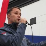Virginia Crossroads: Who’s Rewriting The Rules? Man speaking into a microphone at an outdoor event