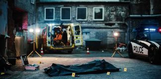 Street Fight Explodes — Child Down crime scene with body bag in alley