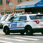 Fleeing Driver, Injured Congresswoman Police car and ambulances outside emergency room entrance.