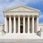 Birthright Brawl Explodes After Supreme Move Front view of the Supreme Court building with large columns and steps under a blue sky
